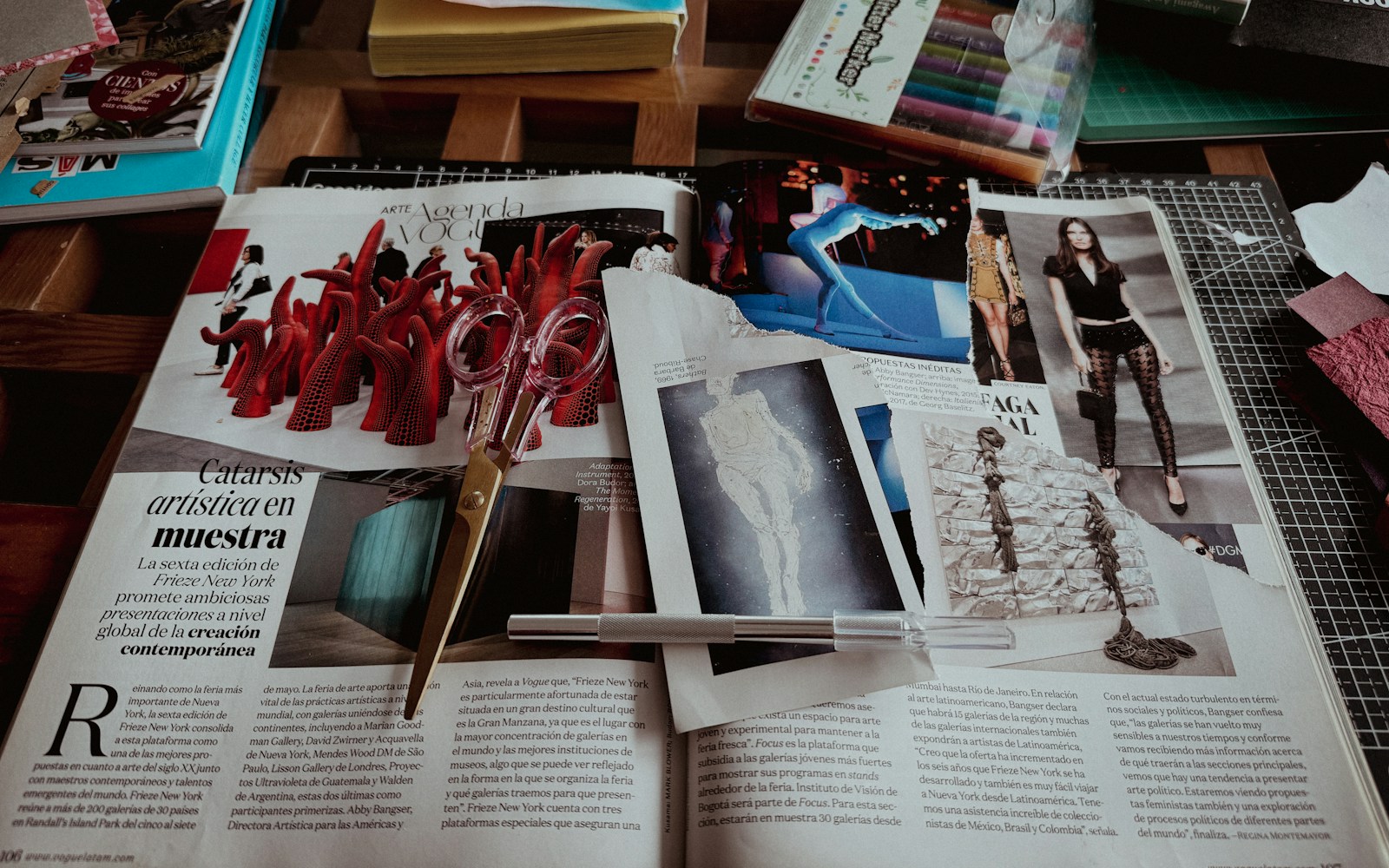 Open magazine spreads with articles and photos laid out for editorial review