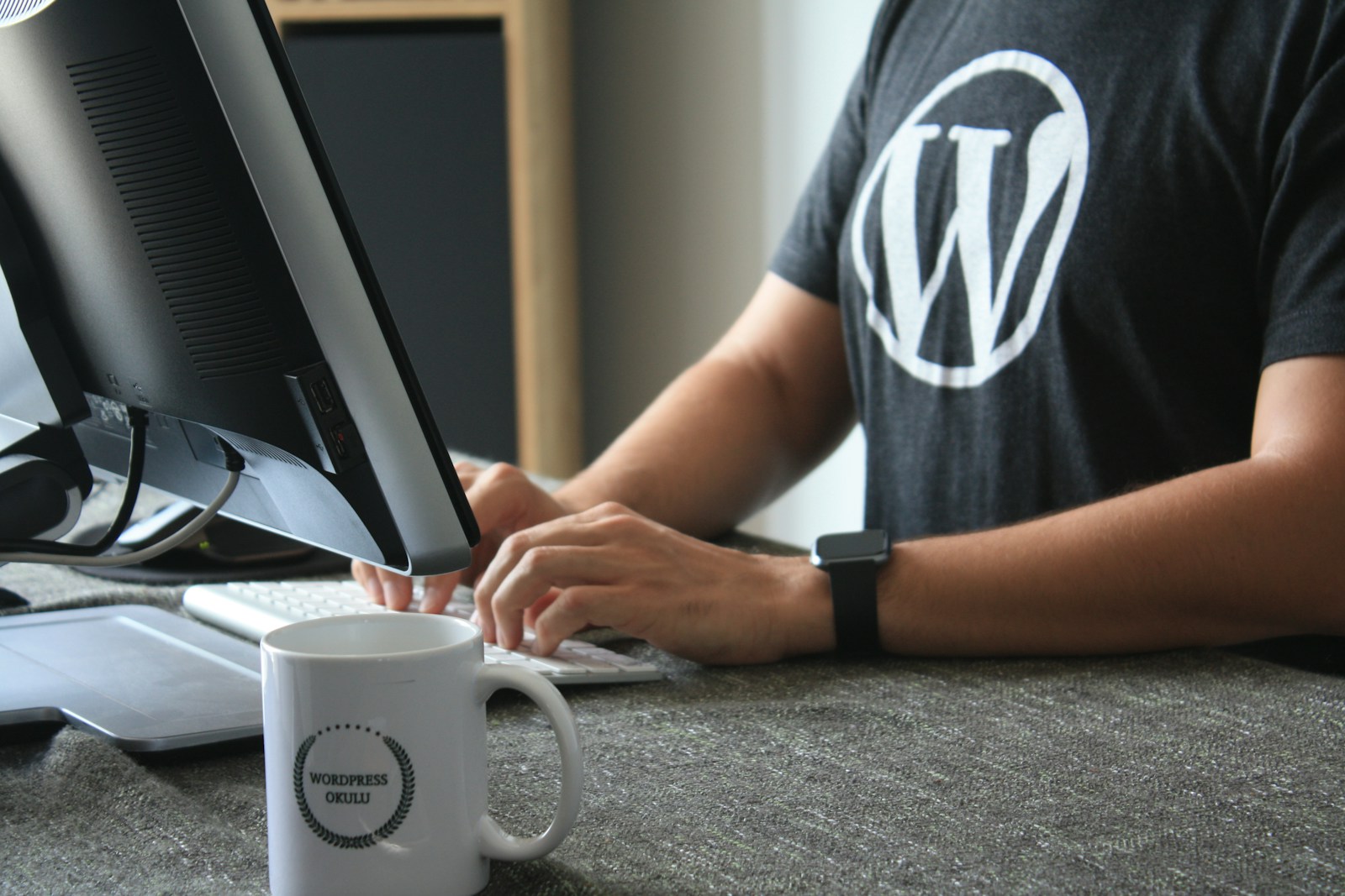 Person editing a WordPress website on a laptop