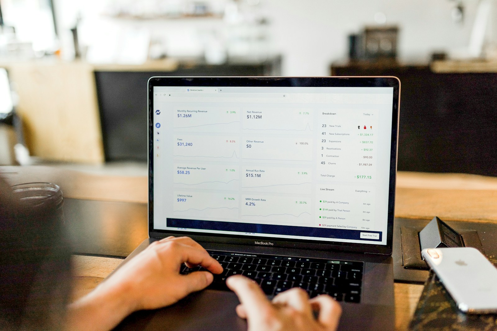 Business owner reviewing their website on a laptop at a desk