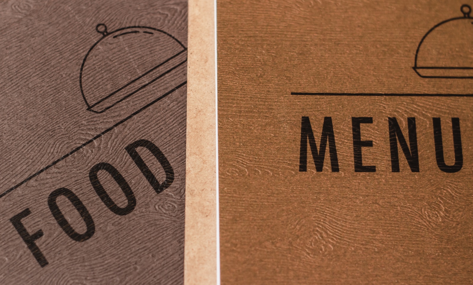 Stack of printed food menu papers on a restaurant table